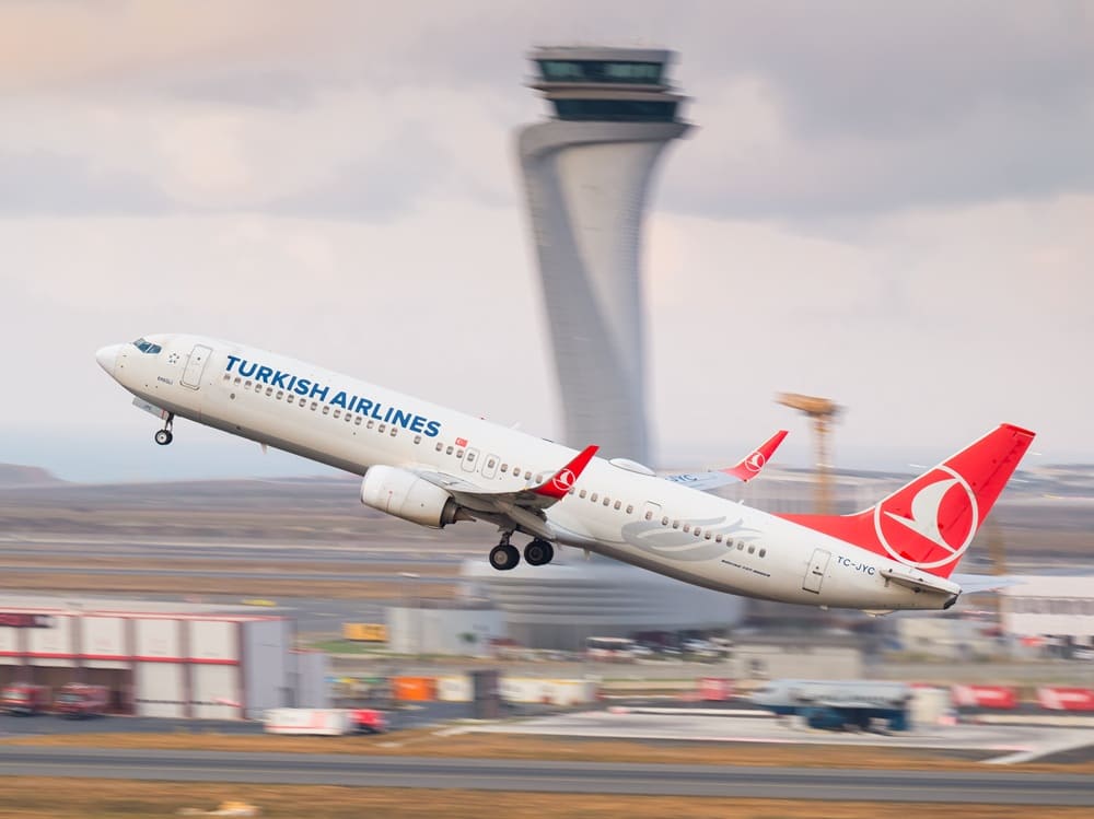 Turkish Airlines plane taking off from Istanbul Airport, popular airline for fans traveling to the 2026 UEFA Europa League Final