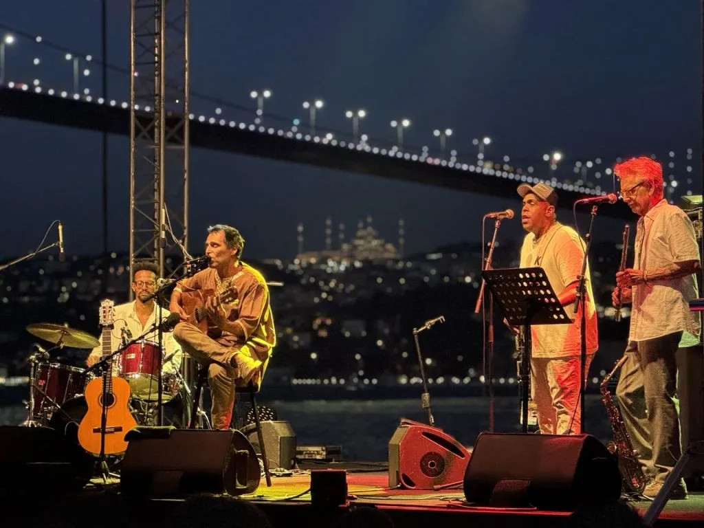 istanbul jazz festival bosphorus open air concert Musicians performing at an open-air jazz concert with the Bosphorus in the background